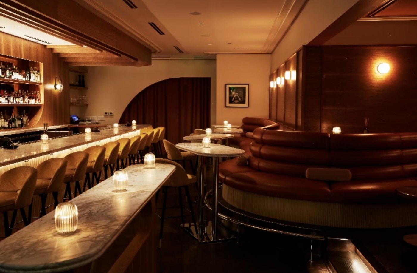 The curved banquette beside the bar